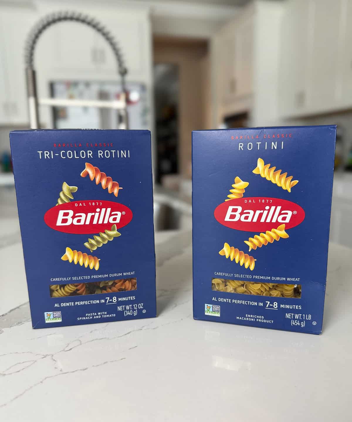 Two boxes of rotini pasta.