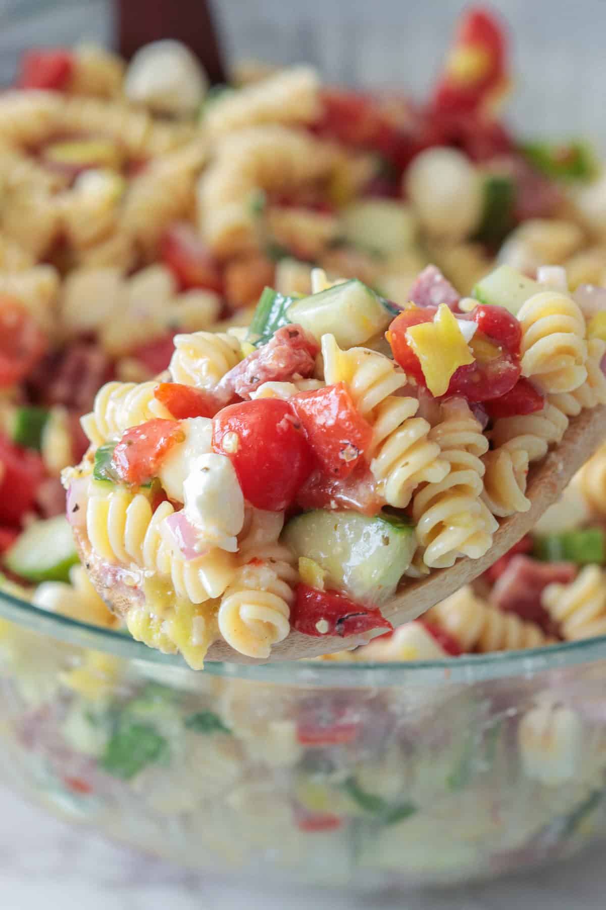 Italian pasta salad on spoon.