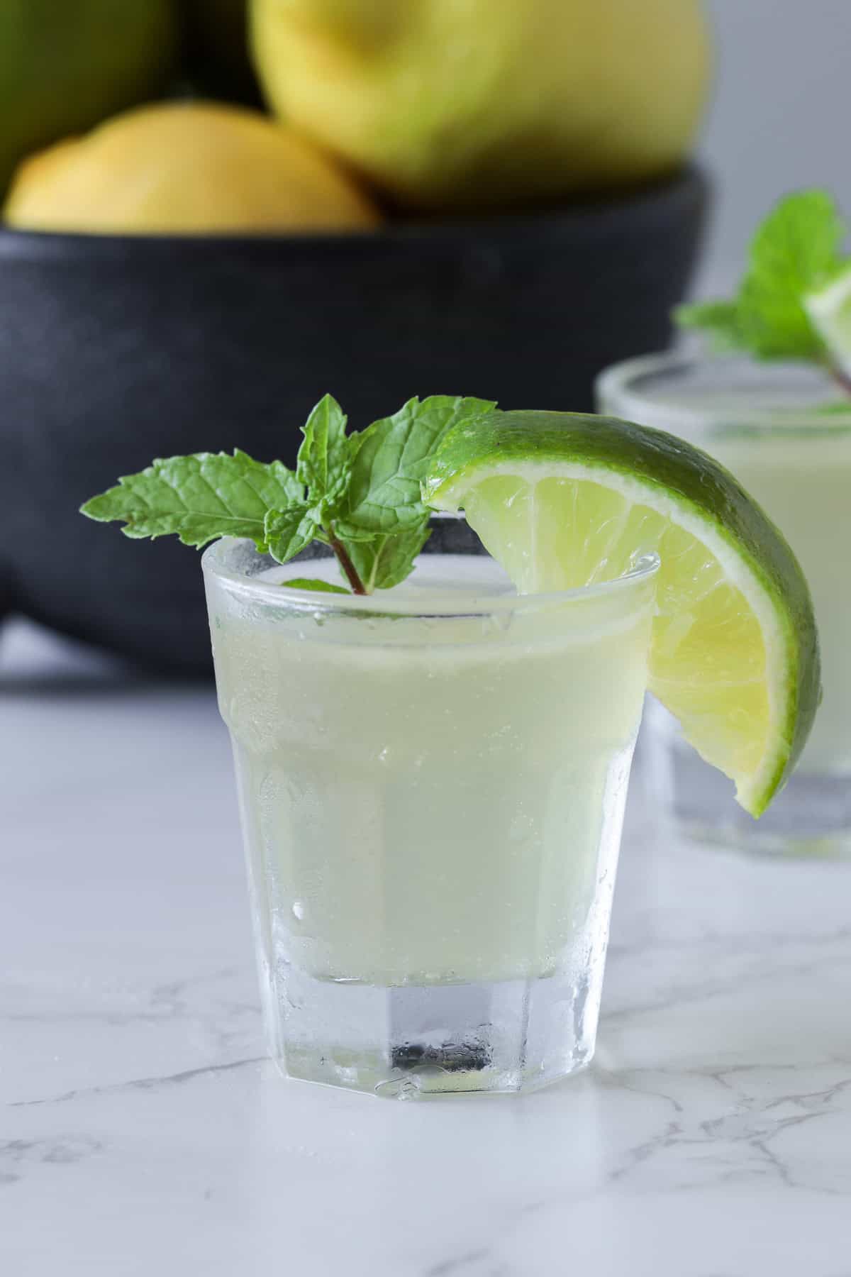 Green tea shot on the table.