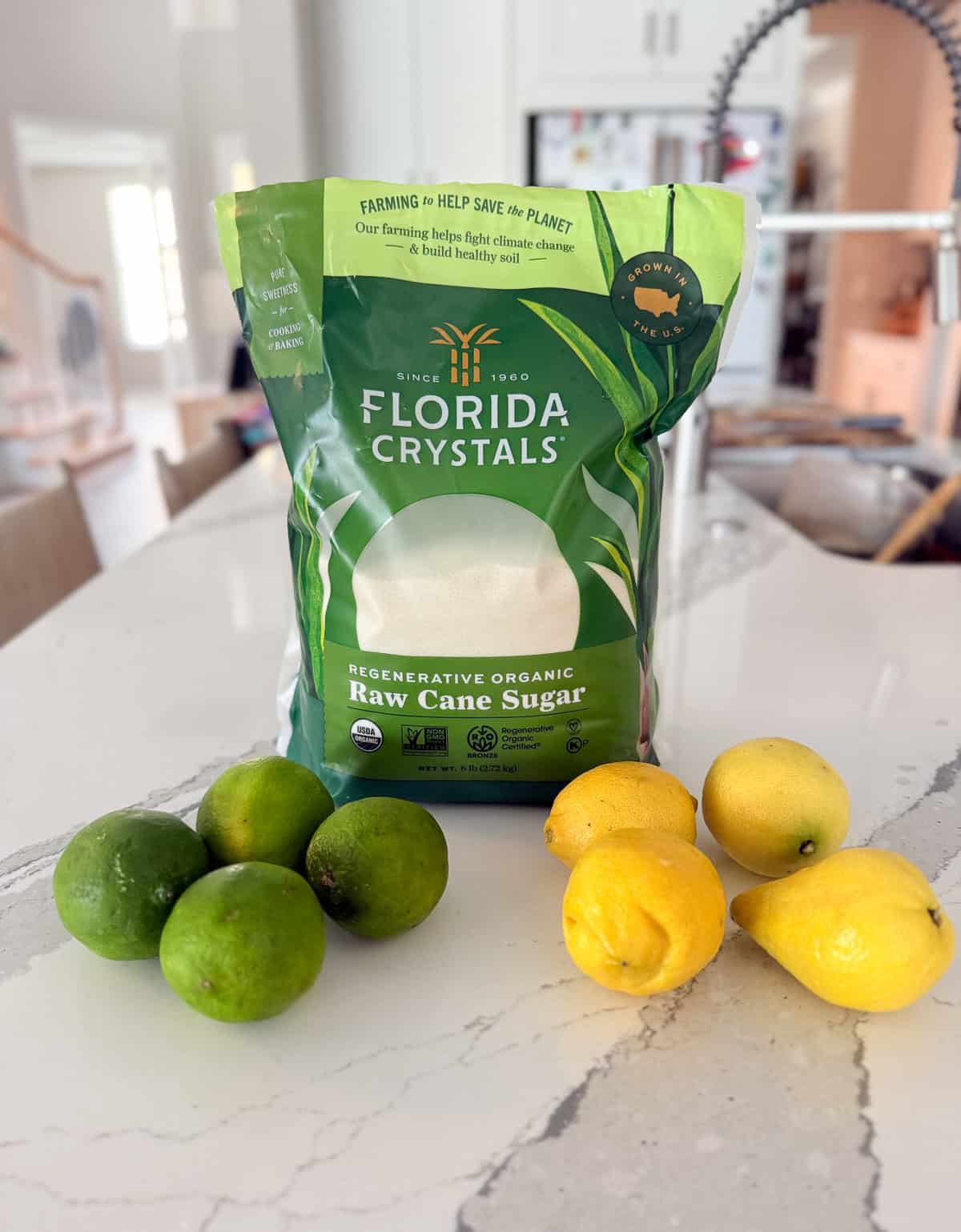Sugar, lemons and limes on the table.
