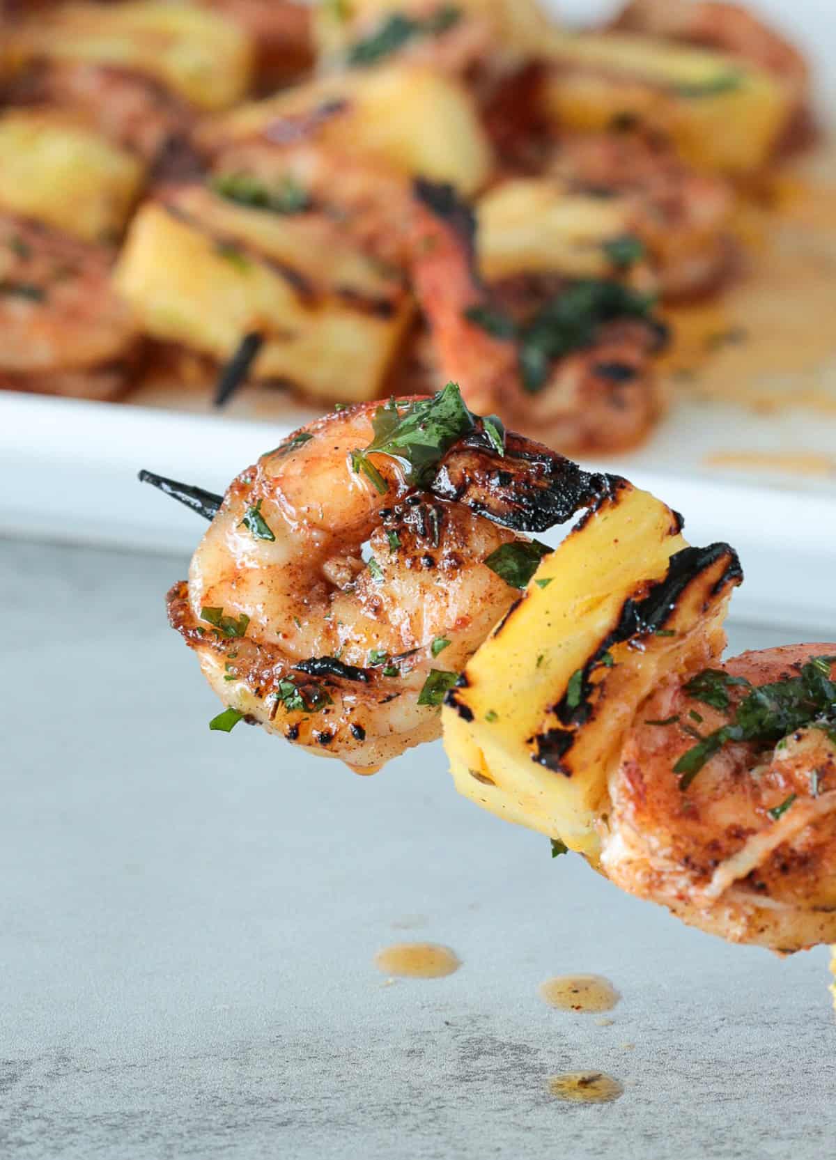 Close up of shrimp pineapple skewers.