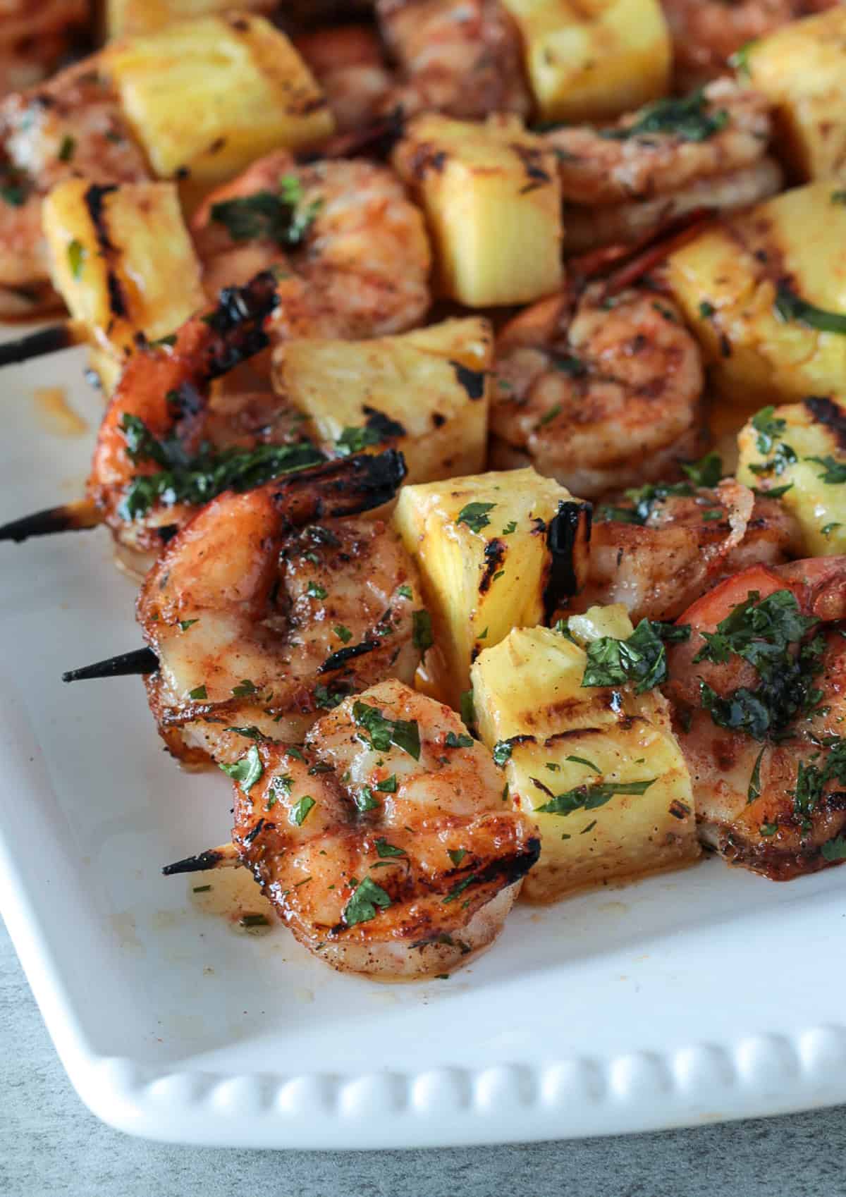 Shrimp and pineapple on a skewer with seasoning.