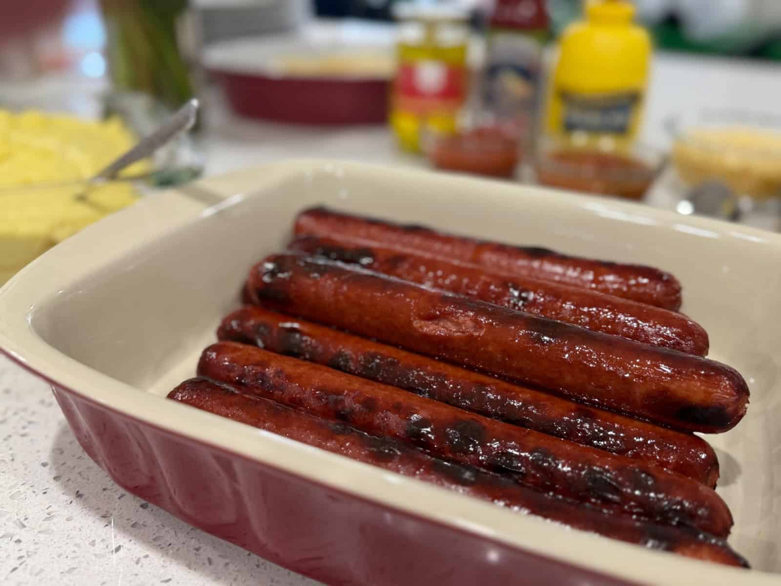 Brazilian hot dog topped with creamy mashed potatoes and condiments