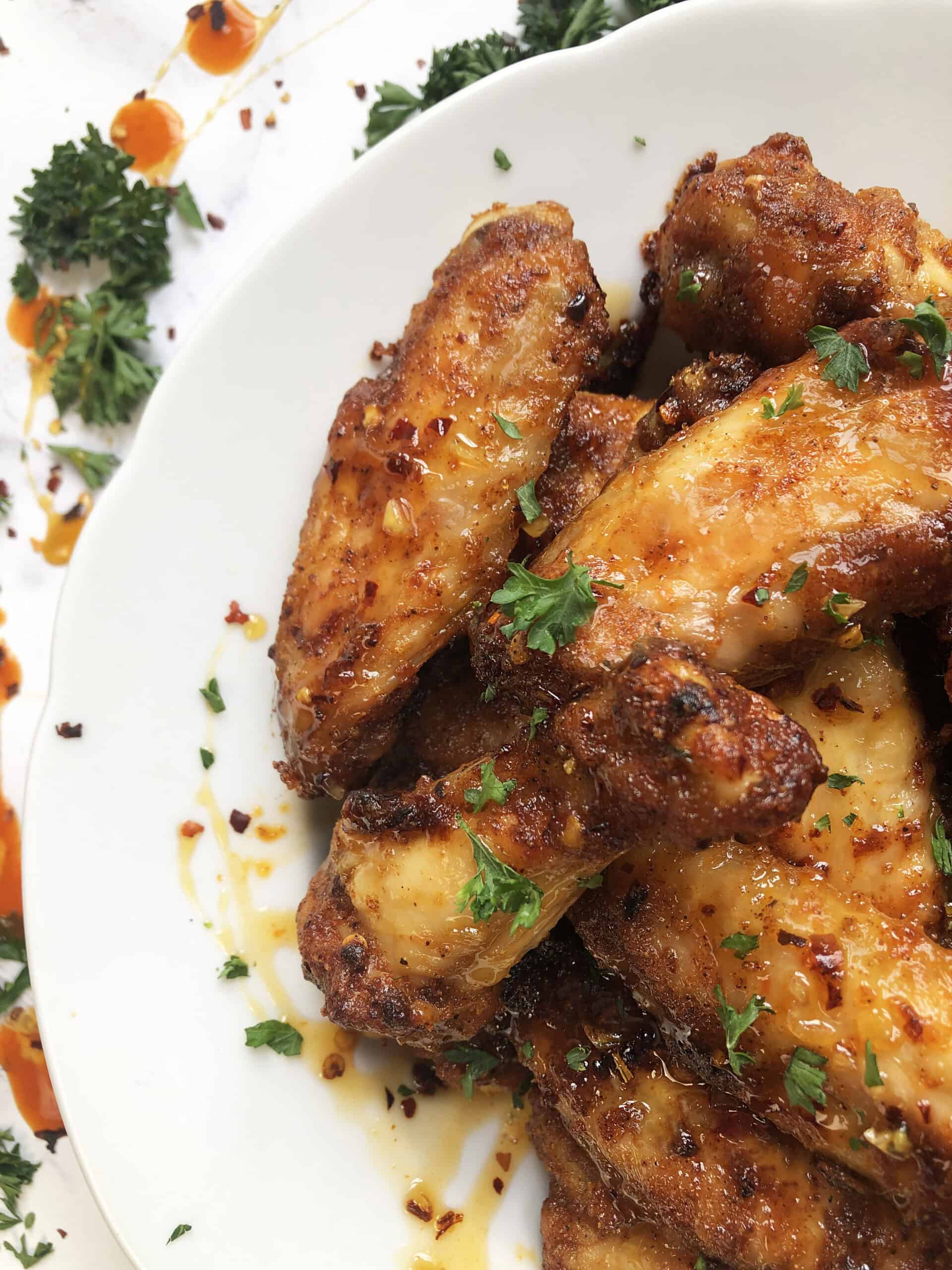 Close-up of crispy baked hot honey wings.