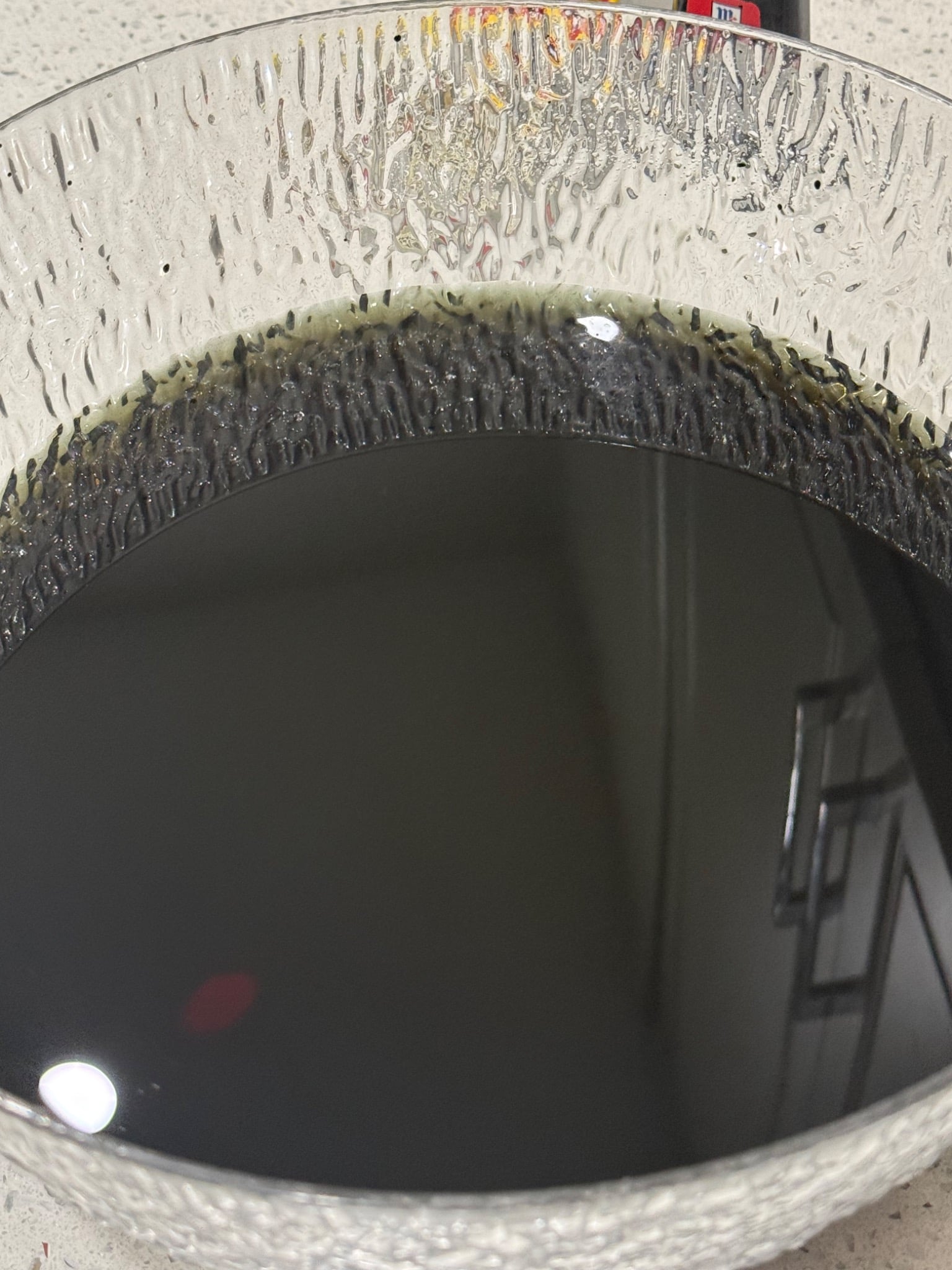 Black food coloring mixed with water for the overnight egg soak